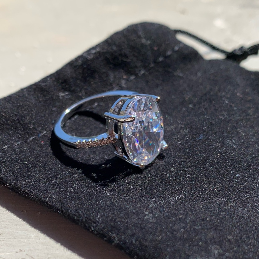 Solid Platinum and Oval Moissanite Engagement Ring